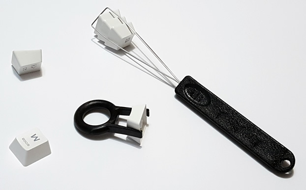 Keycaps removed with a wire and plastic ring puller.