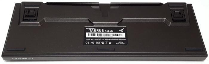 Bottom of the Nebula keyboard showing rubber feet and cable gutter.