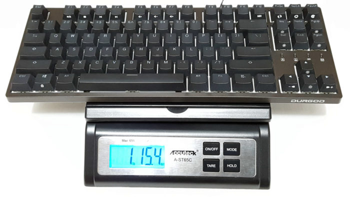Weighing Durgod Nebula mechanical keyboard on scale