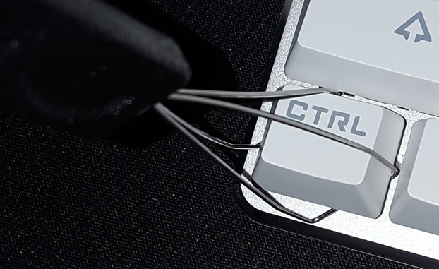 Twist wires until keycap corners are inside wire loops.